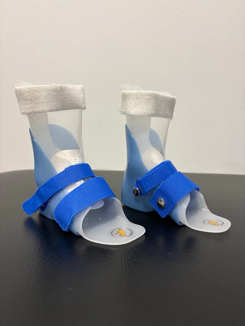A pair of ankle-foot orthotics (AFOs)
