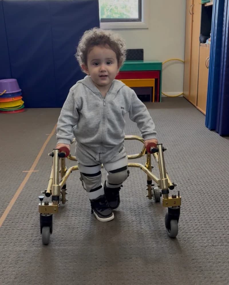 A toddler taking steps in a Nimbo walker